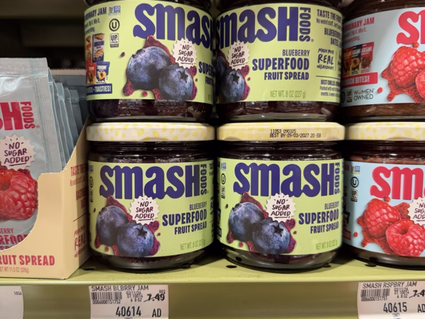 Close-up of shelf price tags showing product names and prices clearly